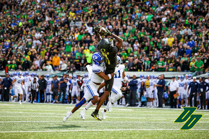Oregon wide receiver Troy Franklin hauls in a deep pass from Bo Nix in a game against the BYU Cougars.